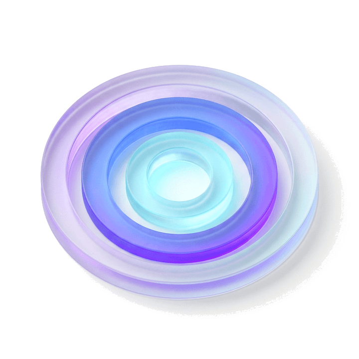 Nested glass rings with light from the inner ring bleeding outward into the next